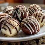 Close-up of homemade shaped Oreo truffles on white plate