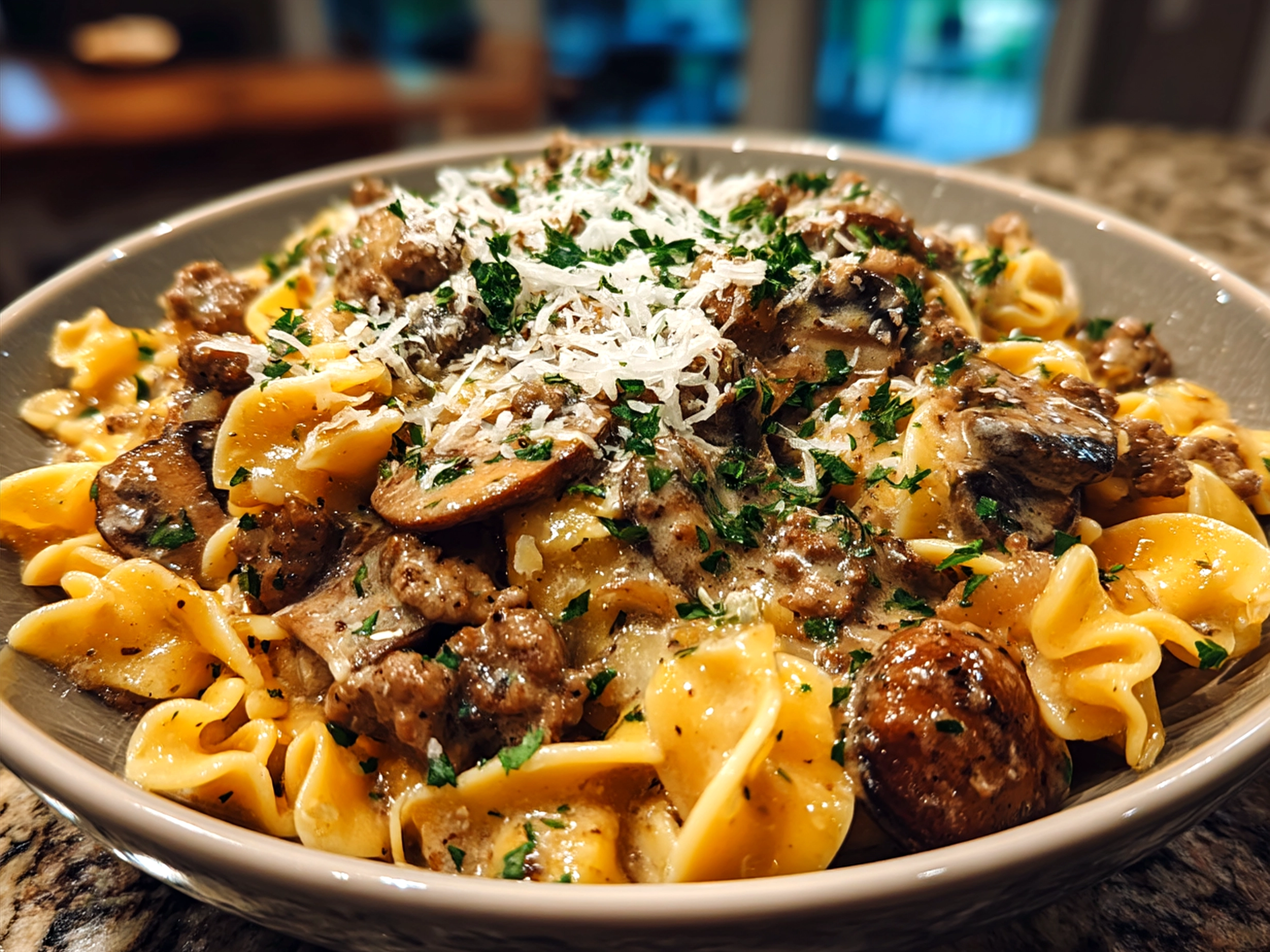 Creamy Ground Beef Stroganoff served over egg noodles on a plate